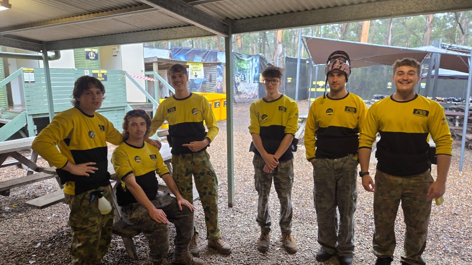 A team of Delta Force marshals wearing yellow uniforms